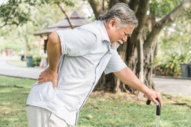 Asian elderly having pain on his back. Asian elderly having pain on his back.