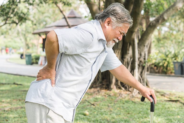 Asian elderly having pain on his back. Asian elderly having pain on his back.