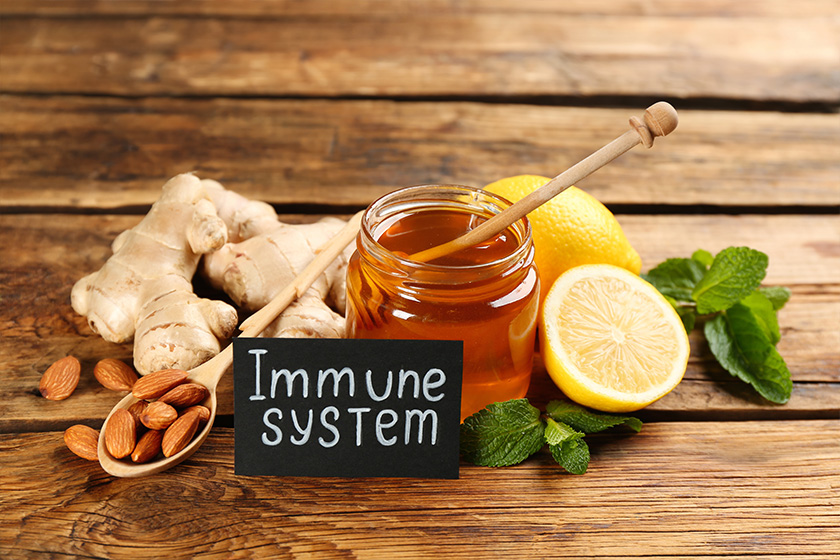 Card with phrase Immune System and fresh products on wooden table Card with phrase Immune System and fresh products on wooden table