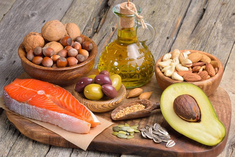 Selection of healthy fat sources on wooden table. Selection of healthy fat sources on wooden table.
