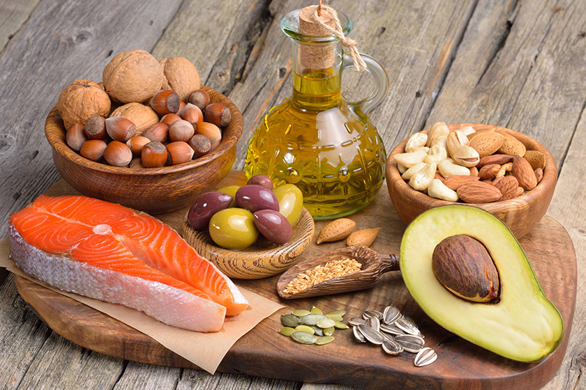Selection of healthy fat sources on wooden table. Selection of healthy fat sources on wooden table.
