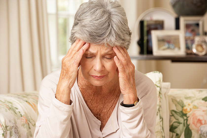 Unhappy Retired Senior Woman Sitting On Sofa At Home Unhappy Retired Senior Woman Sitting On Sofa At Home