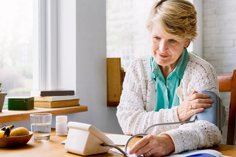 Senior woman checking her own pulse Senior woman checking her own pulse