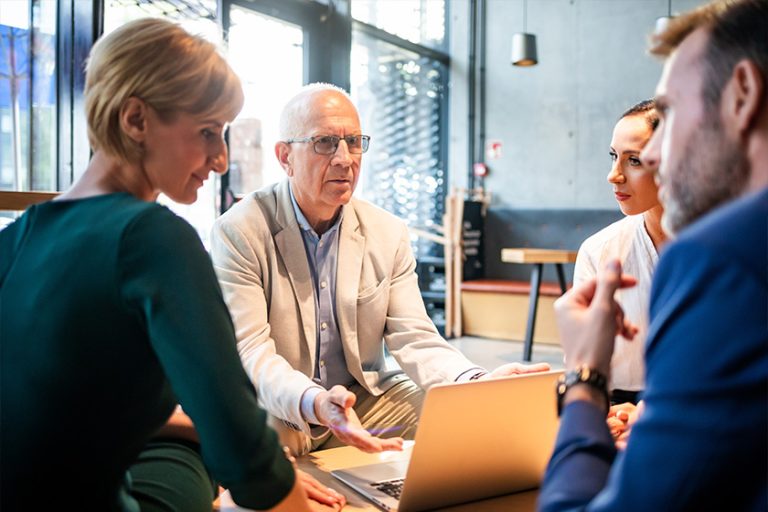 Serious disscussion about project during business meeting in cafe Serious disscussion about project during business meeting in cafe