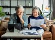 old retired asian senior couple checking and calculate financial