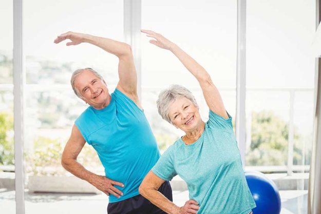 Portrait of senior couple exercising
