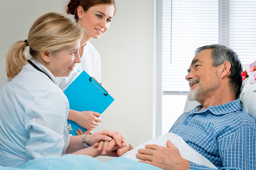 doctor examining a senior patient in hospital doctor examining a senior patient in hospital