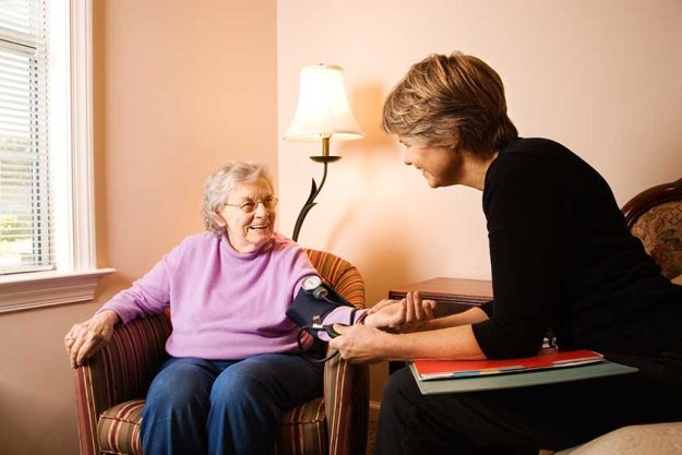 Elderly Woman Having Blood Pressure Taken
