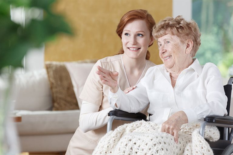 Elder woman is talking with nurse
