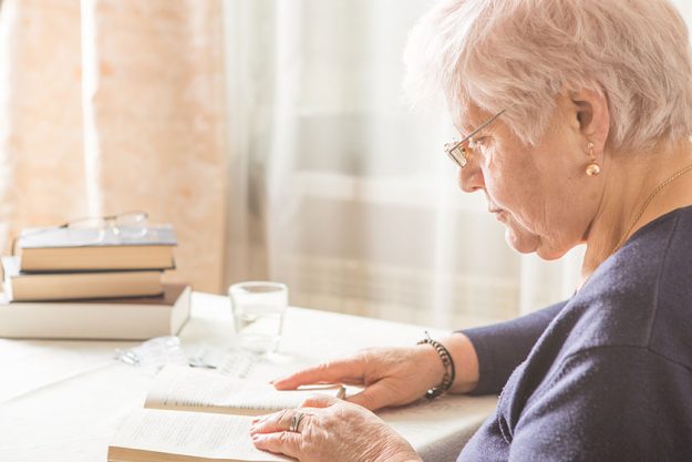 Elderly Caucasian Woman Reads A book Elderly Caucasian Woman Reads A book