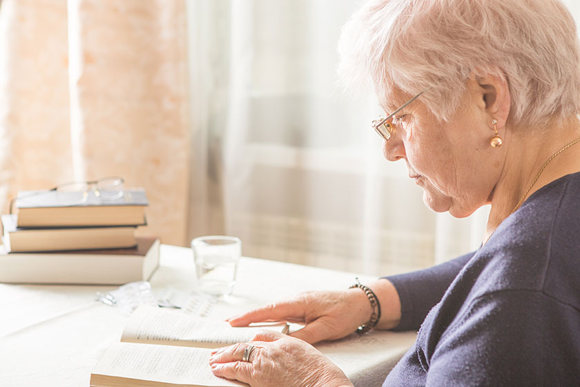 Elderly Caucasian Woman Reads A book Elderly Caucasian Woman Reads A book