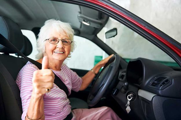 Older woman sitting in a car