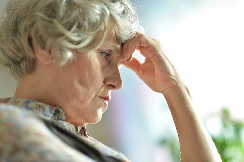 Thoughtful old woman home