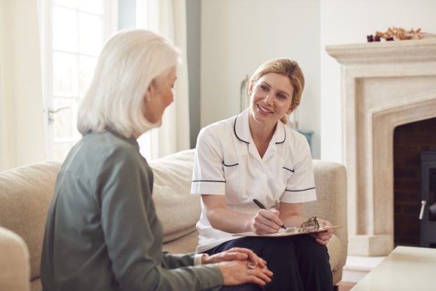 Female Doctor Making Home Visit To Senior Woman For Medical Check Female Doctor Making Home Visit To Senior Woman For Medical Check
