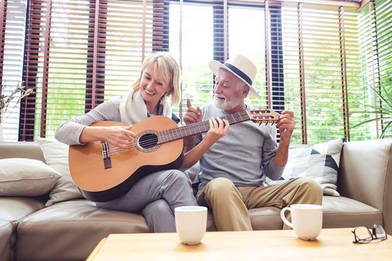 Loving mature couple sitting on the sofa Loving mature couple sitting on the sofa