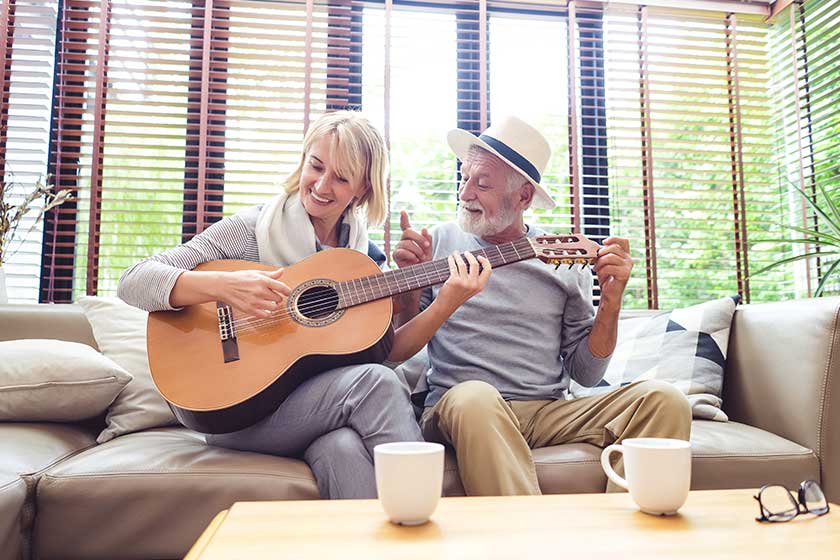Loving mature couple sitting on the sofa Loving mature couple sitting on the sofa