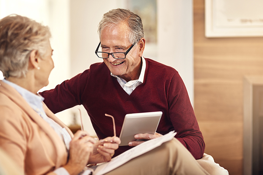 Finance, insurance and tablet with an old couple Finance, insurance and tablet with an old couple