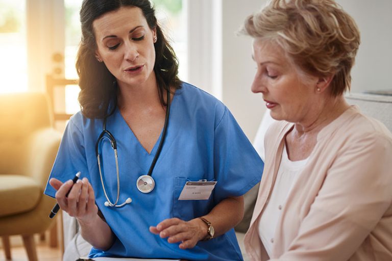 Getting the best healthcare possible. a senior woman talking with a nurse in assisted living facility Getting the best healthcare possible. a senior woman talking with a nurse in assisted living facility