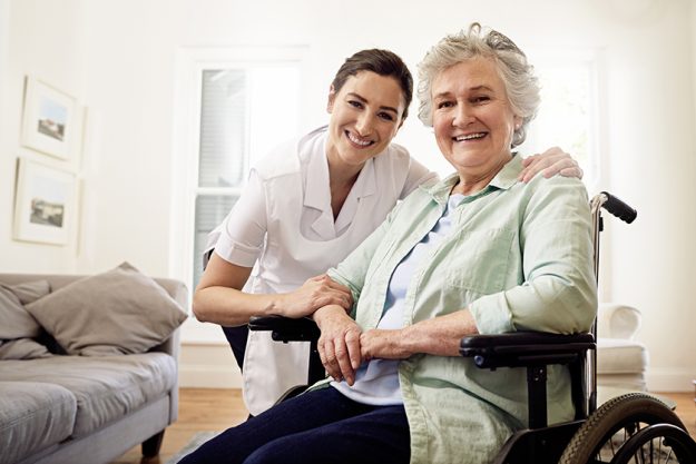Portrait, caregiver and woman in wheelchair