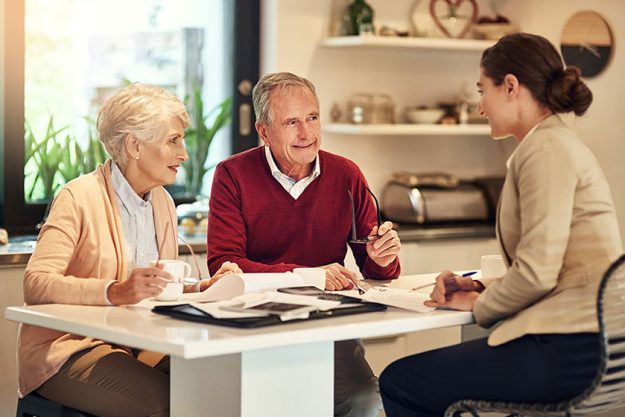 Senior couple, financial advisor and documents