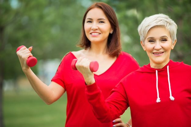 Two beautiful adult women doing sports