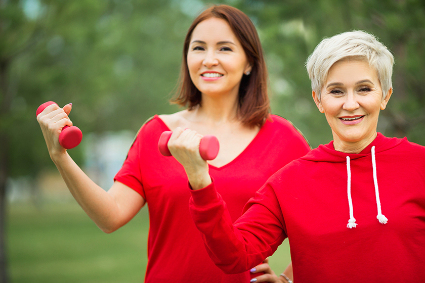 Two beautiful adult women doing sports