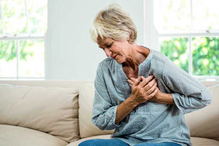 Woman suffering from chest pain Woman suffering from chest pain