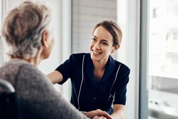 Do you need anything. a female nurse caring for a senior woman in a wheelchair Do you need anything. a female nurse caring for a senior woman in a wheelchair