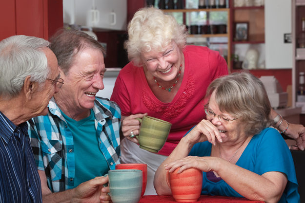 Laughing Friends in Coffeehouse Laughing Friends in Coffeehouse