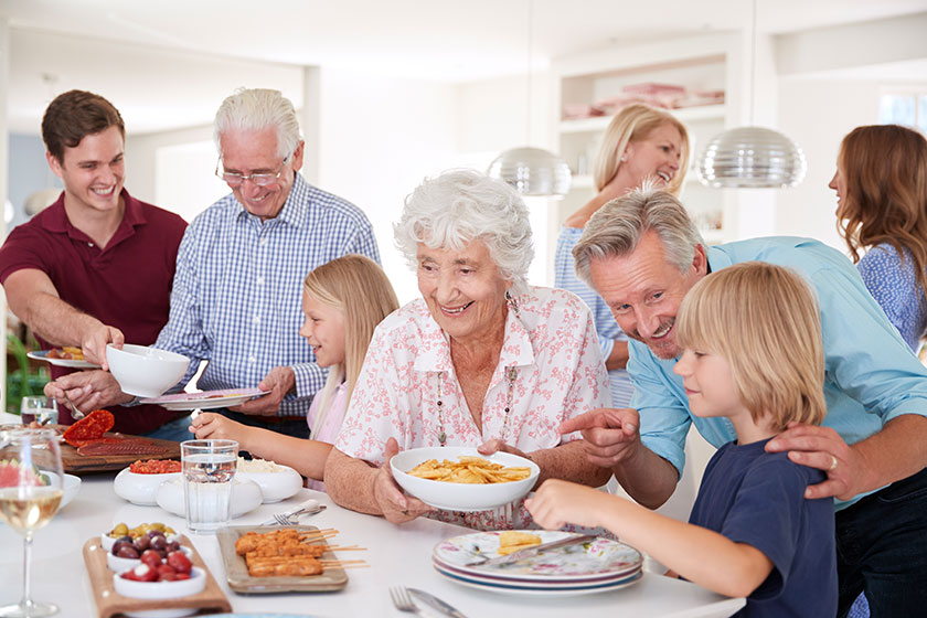multi generation family friends food table