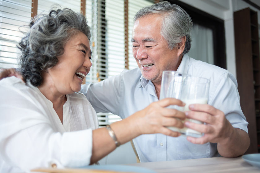 Happy Asian Senior Couple laughing and drinking milk. Happy Asian Senior Couple laughing and drinking milk.