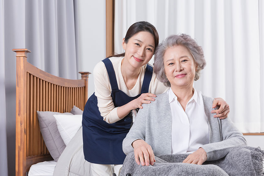 asian caregiver old woman nursing home hospital