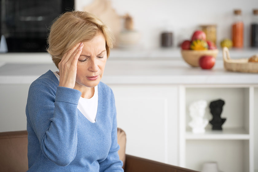 fatigue upset middle aged woman suffering headache touching temporal lobe