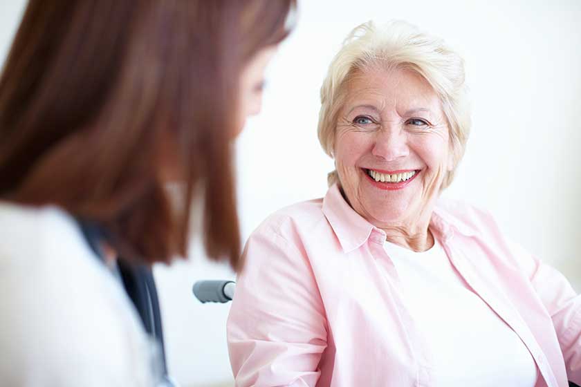 friendly doctor patient relations senior health senior woman wheelchair smiles