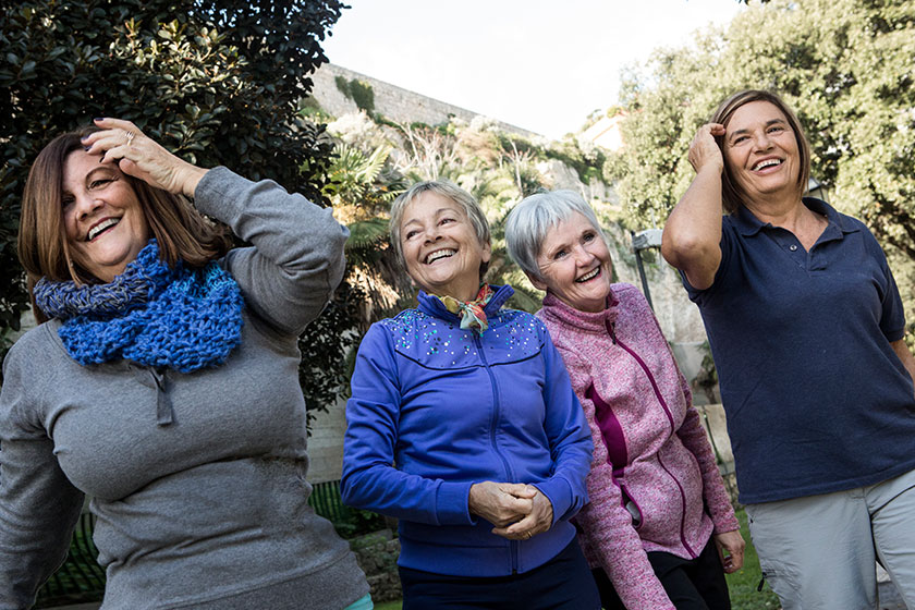 group happy seniors dressed sportswear exercise city park