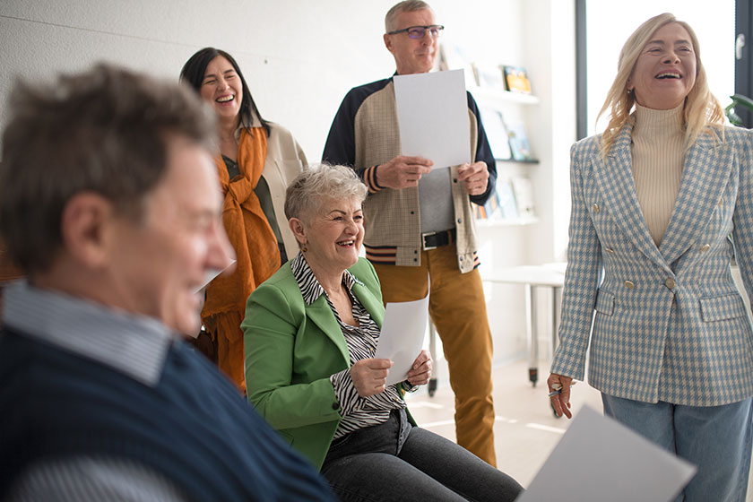 group seniors singing together choir rehearsal
