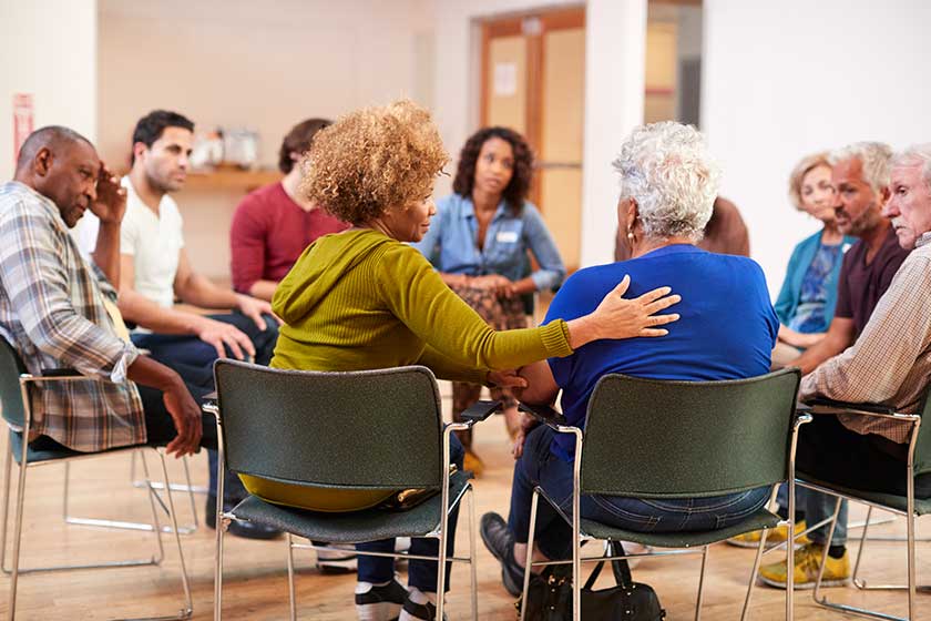 people attending self help therapy group meeting community center people attending self help therapy group meeting community center