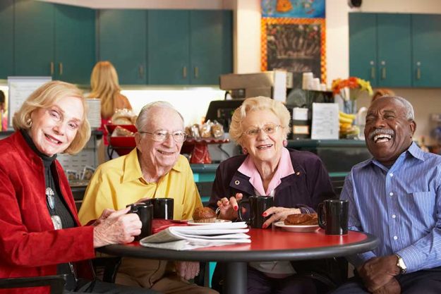 senior adults having morning tea together