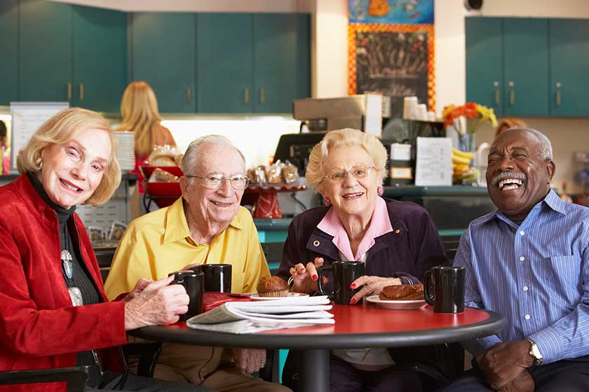 senior adults having morning tea together