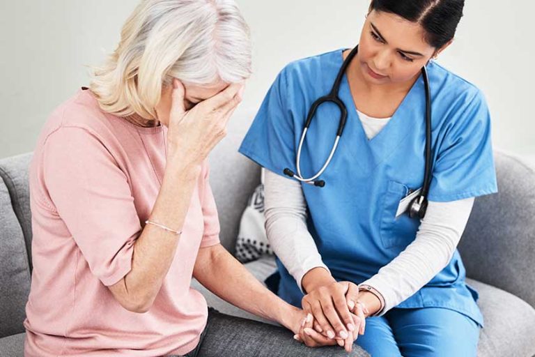 well get you support you need get female nurse comforting well get you support you need get female nurse comforting