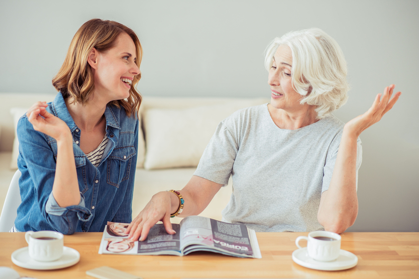 Positive adult woman and her mother talking Positive adult woman and her mother talking