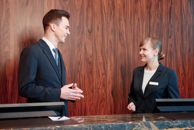 Hotel receptionists behind the counter