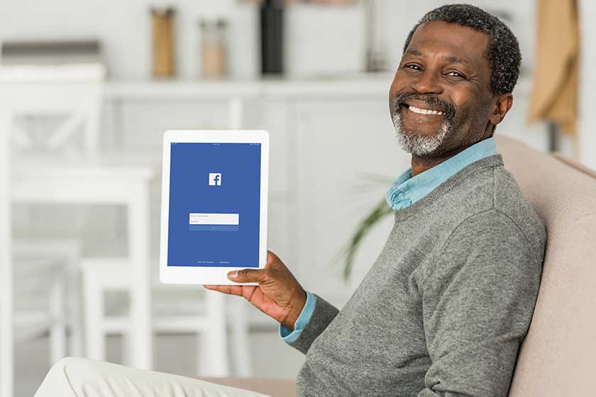 Kyiv ukraine october 2019 cheerful african american man holding digital