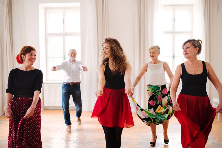 Group of senior people in dancing class with dance teacher Group of senior people in dancing class with dance teacher