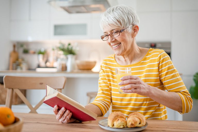 One woman mature senior caucasian female pensioner modern grandmother read