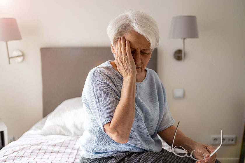 Senior woman suffering headache