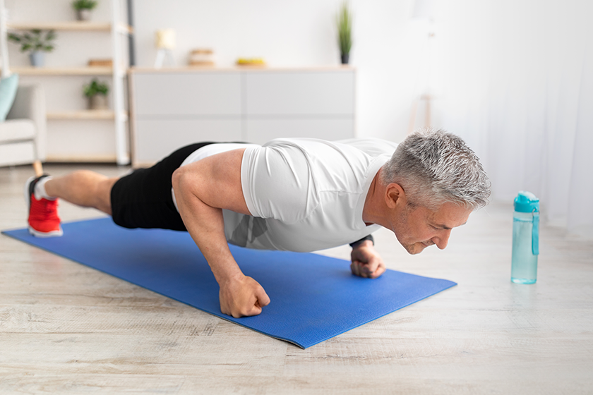 active mature man doing push up