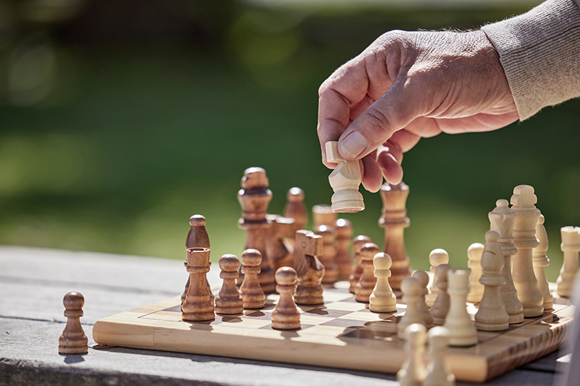 hands man playing chess hands man playing chess