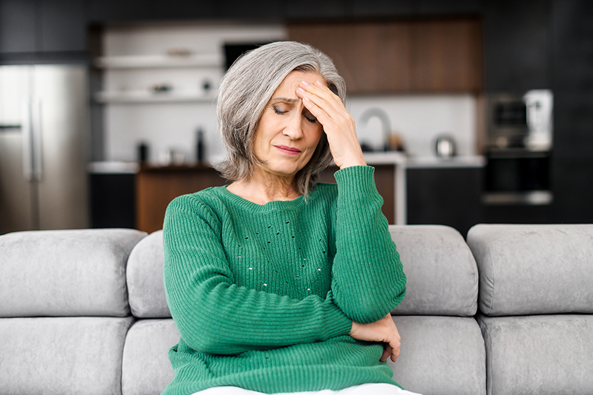 senior woman suffering from headache