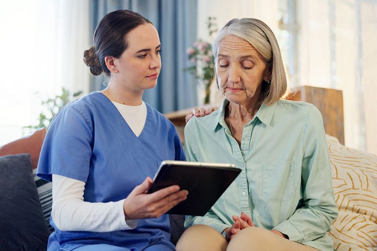 Support nurse senior woman tablet couch results healthcare home kindness Support nurse senior woman tablet couch results healthcare home kindness